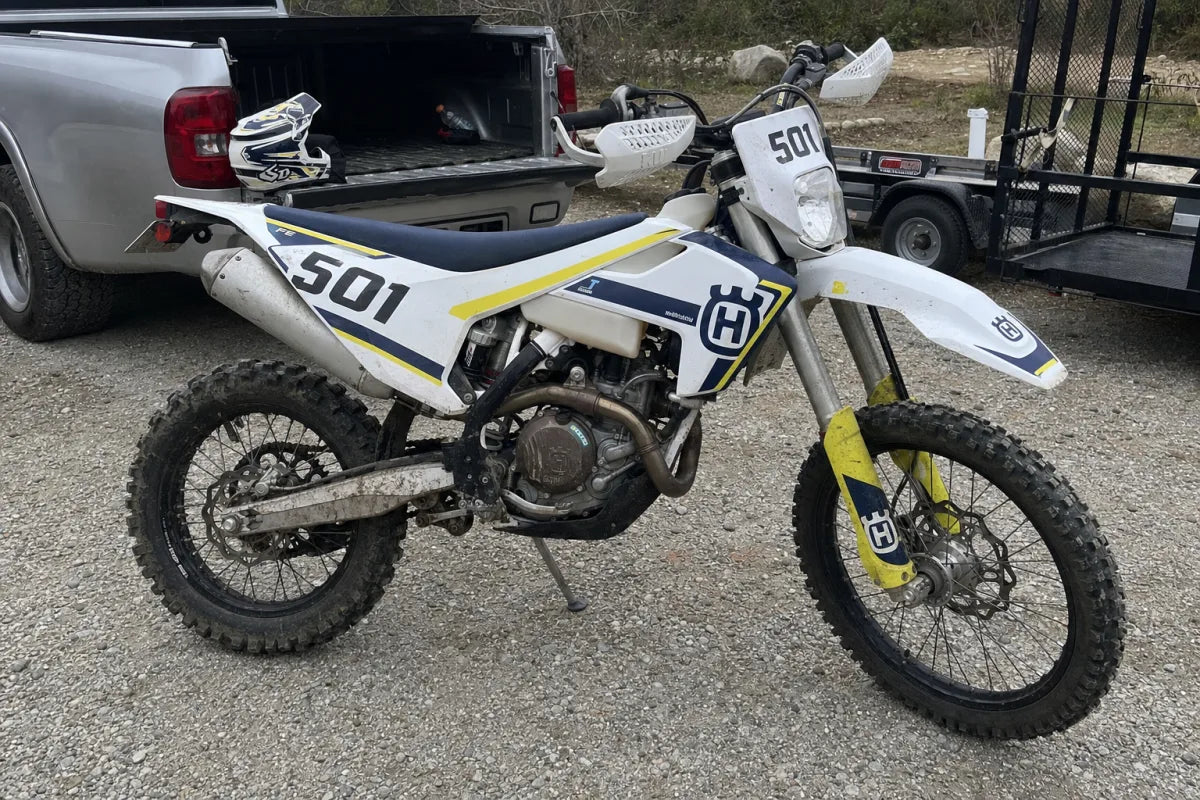 Husqvarna FE 501 with enduro race graphics at a local riding area